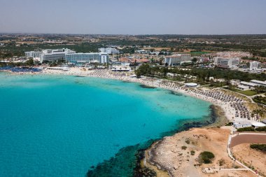 Beautiful aerial view of the most famous beaches in Cyprus - Nissi Beach, Landa beach, Pantachou Beach clipart