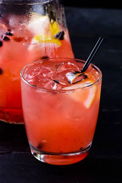 Fresh strawberry lemonade in glass jug, copy space — Stock Photo, Image