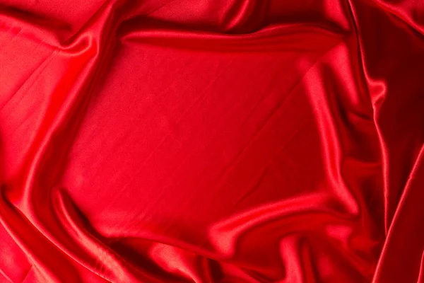 摘要红色背景的奢侈品或液体波纹或波浪形折边丝质绸缎丝绒面料 浅色丝织物仿制空间中纹波的闭合 — 图库照片