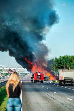 accident and fire on the road vertically, truck in fire with black smoke on the road clipart