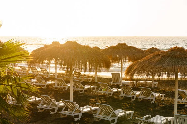 Straw Beach Umbrella Blue Sky Sunbeds Black Volcanic Beach Caletta — Stock Photo, Image