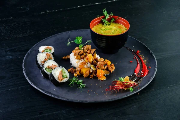 Japanese lunch set. Asian food set soup, sushi rolls and side dish, rice in a bowl with miso soup