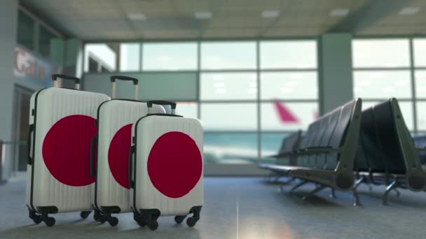 Podróżne walizki z flaga Japonii. Koncepcyjne animacji japońskiej turystyki — Wideo stockowe