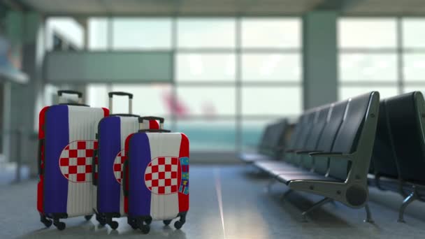 クロアチアの旗を備えたスーツケースを旅行します。クロアチア観光概念のアニメーション — ストック動画