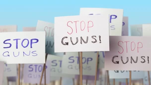 STOP GUNS placards at street demonstration. Conceptual loopable animation — Stock Video