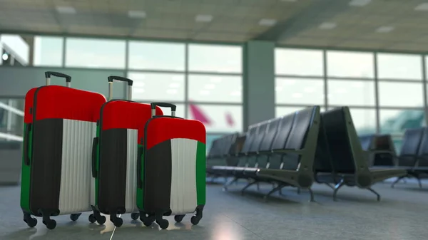 Malas de viagem com bandeira dos Emirados Árabes Unidos. UAE turismo conceitual 3D renderização — Fotografia de Stock