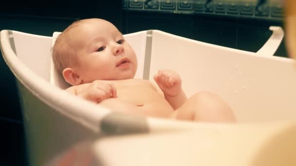 Happy baby girl in a bathtub — Stock Video