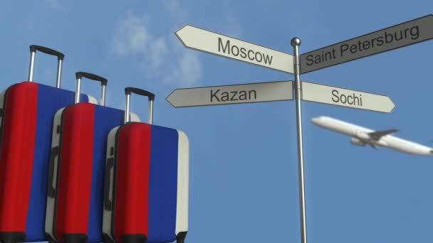 Travel baggage featuring flag of Russia, airplane and city sign post. Russian tourism conceptual animation — Stock Video