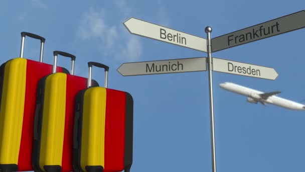 Travel baggage featuring flag of Germany, airplane and city sign post. German tourism conceptual animation — Stock Video