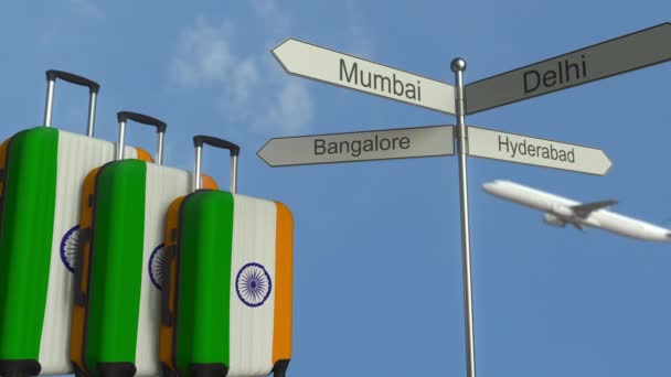 Travel baggage featuring flag of India, airplane and city sign post. Indian tourism conceptual animation — Stock Video