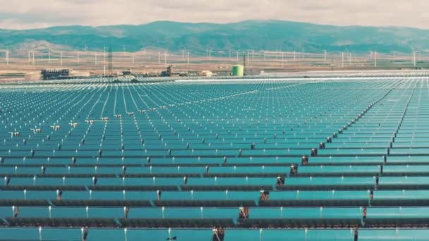 Solar power plant and wind farm in Spain, aerial view. Clean energy production — Stock Video