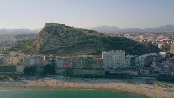 Aerial panoramic view of Alicante cityscape involving beachfront and Santa Barbara castle, Spain — Stock Video