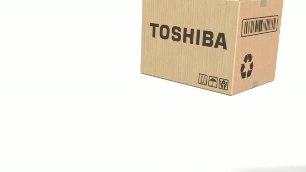 Caja de caída con logo Toshiba. Animación Editorial 3D — Vídeo de stock
