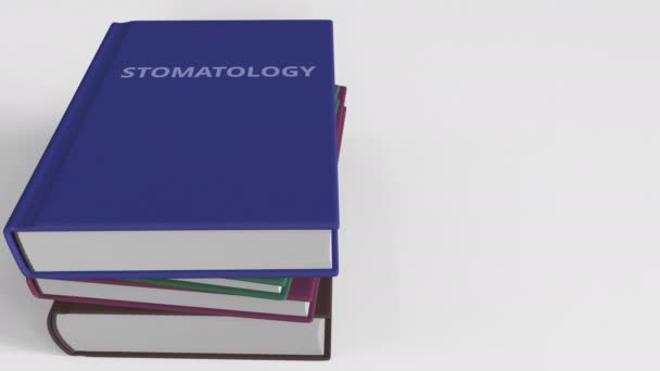 Capa de livro com título STOMATOLOGY. Animação 3D — Vídeo de Stock