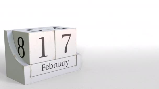 Calendario de cubos de madera muestra fecha 17 de febrero, animación 3D — Vídeos de Stock