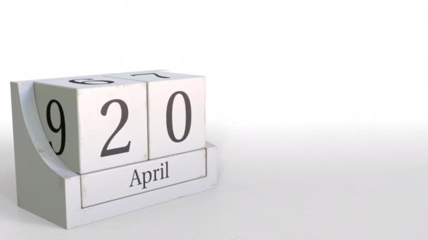 Calendário de blocos de madeira mostra 20 de abril data, animação 3D — Vídeo de Stock