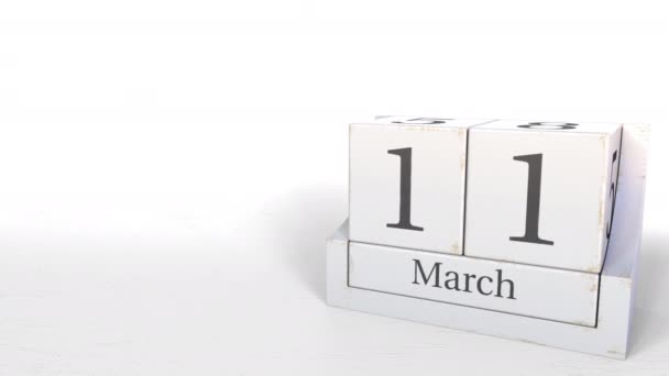 Wood cube calendar shows March 11 date, 3D animation — Stock Video