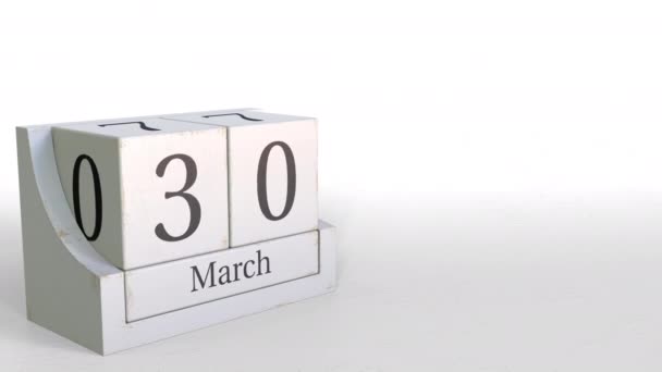 Календарь Куба показывает дату 30 марта. 3D анимация — стоковое видео