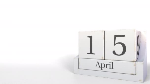 Kubus kalender bevat 15 April datum. 3D animatie — Stockvideo