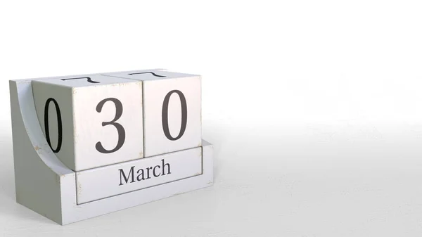 El calendario cubo muestra la fecha del 30 de marzo. Renderizado 3D —  Fotos de Stock
