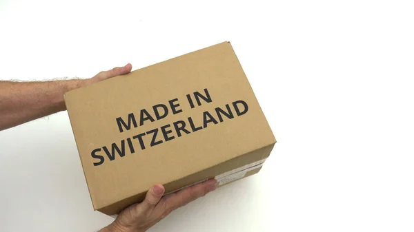 İsviçre içinde yapılan metin kutusunu elinde — Stok fotoğraf