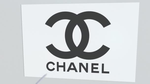 Archery arrow breaks glass plate with CHANEL company logo. Business issue conceptual editorial animation — Stock Video