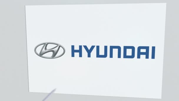 HYUNDAI company logo being hit by archery arrow. Business crisis conceptual editorial animation — Stock Video