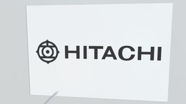 Tiro con arco de flecha golpea la placa con el logotipo de HITACHI. Problemas corporativos animación editorial conceptual — Vídeo de stock