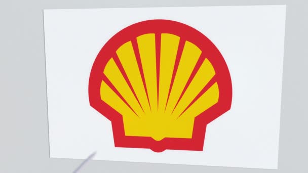 Das Firmenlogo der Shell wird durch einen Pfeil geknackt. Unternehmensprobleme konzeptionelle redaktionelle Animation — Stockvideo