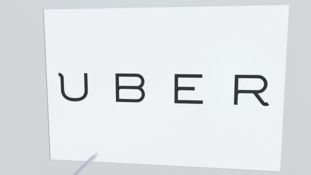 Logotipo de la empresa UBER está agrietado por flecha de tiro con arco. Problemas corporativos animación editorial conceptual — Vídeo de stock