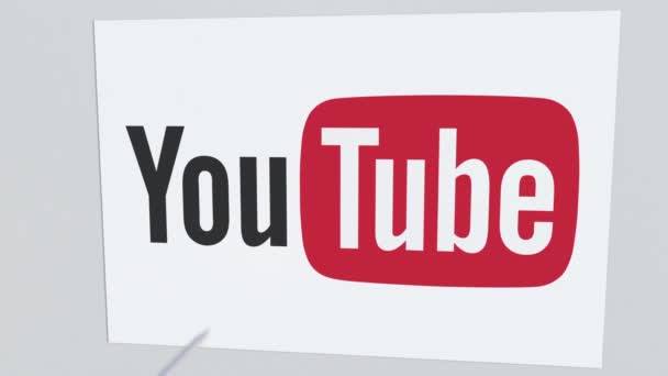 Archery arrow breaks glass plate with YOUTUBE company logo. Business issue conceptual editorial animation — Stock Video