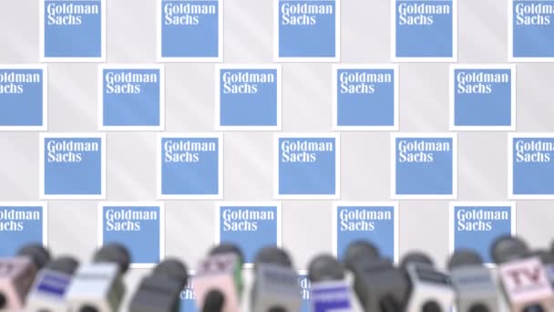 Press conference of GOLDMAN SACHS, press wall with logo and microphones, conceptual editorial animation — Stock Video