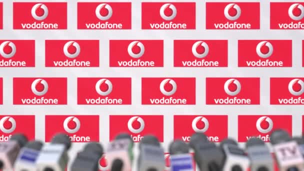 Vodafone Şirket basın toplantısı, logo ve mikrofonlar, kavramsal editoryal animasyon ile basın duvar — Stok video