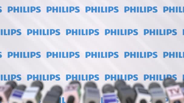 Tisková konference společnosti Philips, stiskněte tlačítko zeď s logem a mikrofony, koncepční redakční animace — Stock video