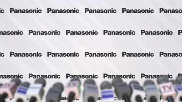 Naciśnij konferencji Panasonic, naciśnij ściany z logo i mikrofony, koncepcyjny redakcji renderowania 3d — Zdjęcie stockowe