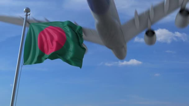 Aereo commerciale che atterra dietro sventola bandiera bengalese. Viaggio in Bangladesh animazione concettuale — Video Stock