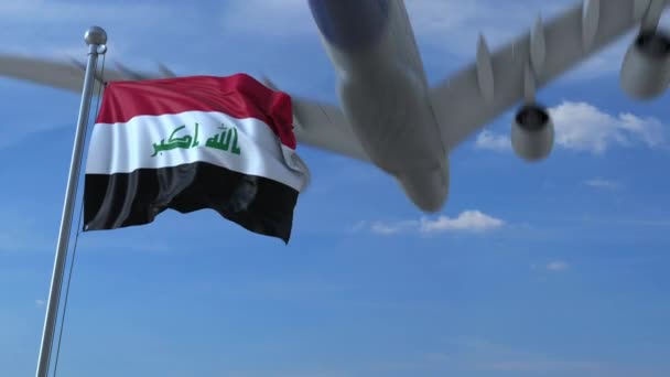 Kommersiella flygplan landar bakom viftande irakiska flaggan. Resa till Irak konceptuella animation — Stockvideo