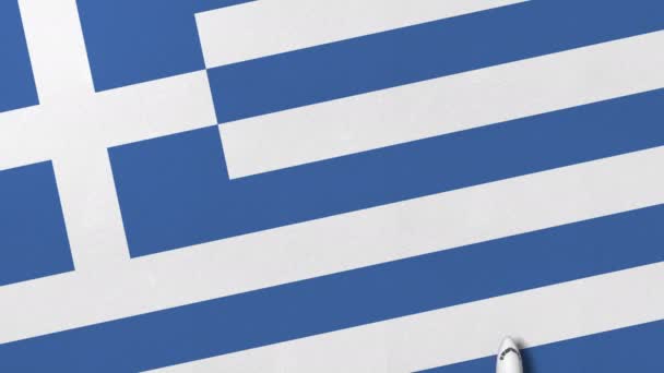 Avión comercial en la bandera de Grecia. Viajes relacionados con la animación conceptual 3D — Vídeos de Stock