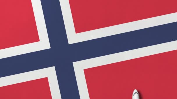 Avión comercial en la bandera de Noruega. Animación 3D conceptual relacionada con el turismo — Vídeos de Stock