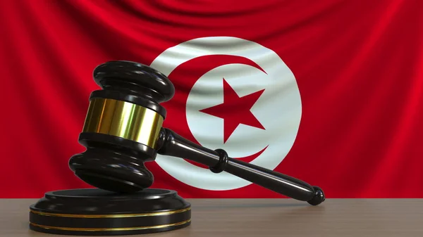 Juízes martelo e bloco contra a bandeira da Tunísia. Tunisiano tribunal conceitual 3D renderização — Fotografia de Stock