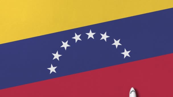 Commerciële vliegtuig op de vlag van Venezuela. Reis verwante conceptuele 3d animatie — Stockvideo