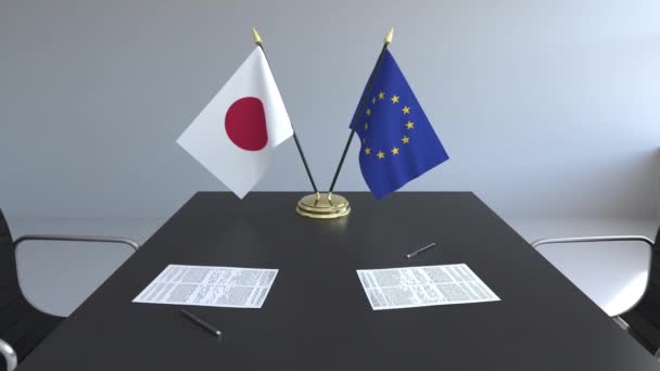 Drapeaux du Japon et de l'Union européenne et documents sur la table. Négociations et signature d'un accord international. Animation 3D conceptuelle — Video