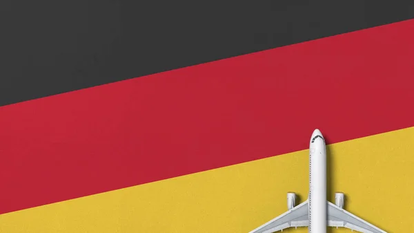 Verkehrsflugzeug unter der Flagge Deutschlands. Tourismusbezogene konzeptionelle 3D-Darstellung — Stockfoto