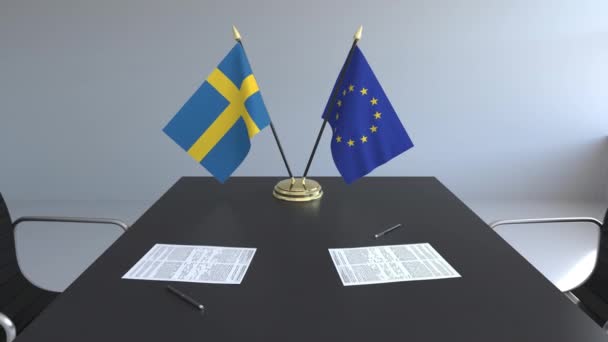 Bandiere della Svezia e dell'Unione europea e documenti sul tavolo. Negoziati e firma di un accordo internazionale. Animazione 3D concettuale — Video Stock