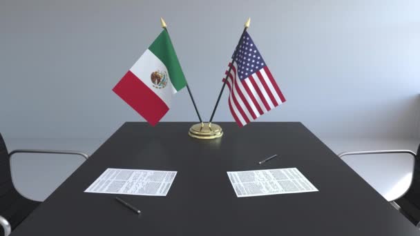 Drapeaux du Mexique et des États-Unis et papiers sur la table. Négociations et signature d'un accord international. Animation 3D conceptuelle — Video