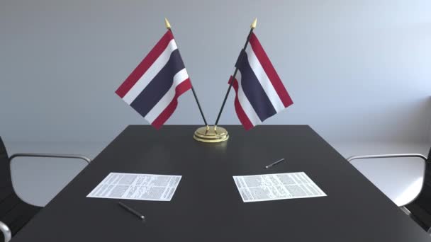 Flags of Thailand and papers on the table. Negotiations and signing an agreement. Conceptual 3D animation — Stock Video