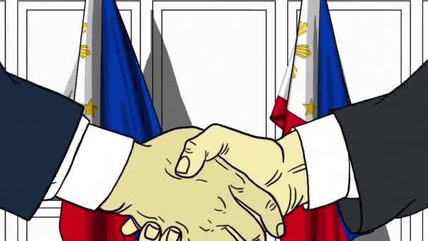 Des hommes d'affaires ou des politiciens serrent la main contre les drapeaux des Philippines. Réunion officielle ou animation de bande dessinée liée à la coopération — Video