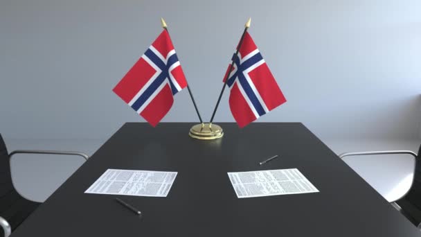 Banderas de Noruega y papeles sobre la mesa. Negociaciones y firma de un acuerdo. Animación 3D conceptual — Vídeos de Stock