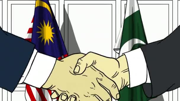 Affärsmän eller politiker skakar hand mot flaggor av Malaysia och Pakistan. Officiellt möte eller samarbete med tecknad animation — Stockvideo