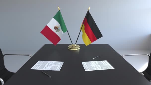 Příznaky, Mexika a Německa a papíry na stole. Jednání a podepisování mezinárodní dohody. Konceptuální 3d animace — Stock video